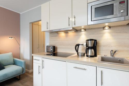 Kuchyň nebo kuchyňský kout v ubytování Strandhotel Laboe Nr 21