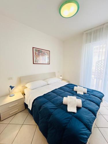 Ένα ή περισσότερα κρεβάτια σε δωμάτιο στο Bixio Leisure Flexrent - Immobiliare Abissinia