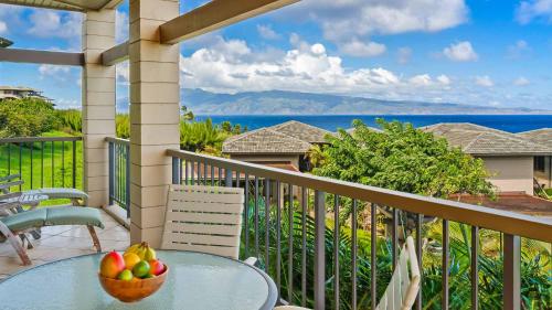 a bowl of fruit on a table on a balcony at Kapalua Ridge Villa 1112 in Kapalua
