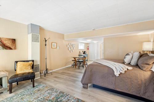 a bedroom with a bed and a dining room at 325 6th Ave Unit A in Ouray