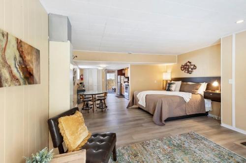 a hotel room with a bed and a living room at 325 6th Ave Unit A in Ouray