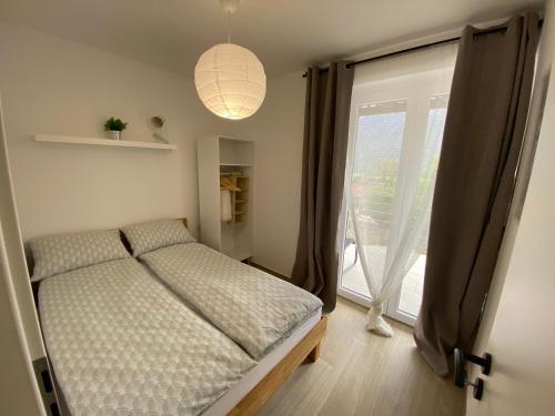 Letto o letti in una camera di Apartmaji Sofija&Ana
