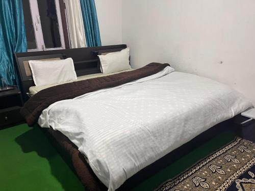 Ένα ή περισσότερα κρεβάτια σε δωμάτιο στο Sky View Homestay