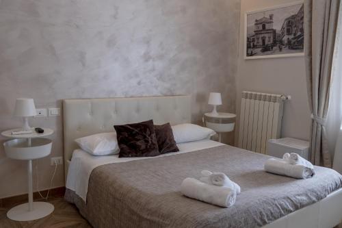 Postel nebo postele na pokoji v ubytování Domus Monasteire