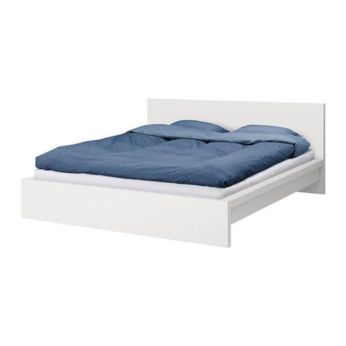 a bed with a blue blanket on a white platform at Blue Elephant Room! in Lucan