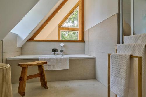 a bathroom with a sink and a window at Apartment Rehwiese in Burg