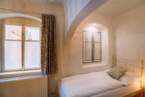 Apartmány Nathan - Ubytování s příběhemにあるベッド