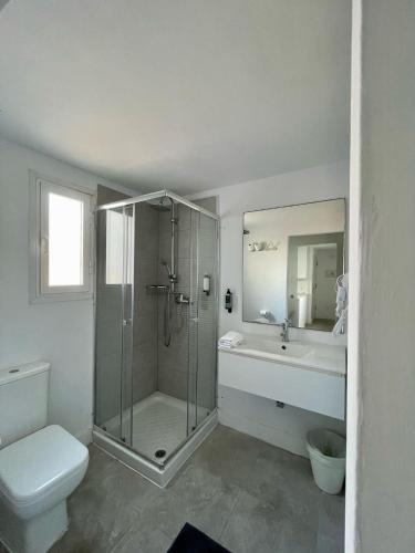 a bathroom with a shower and a toilet and a sink at Casthotels Leblon in El Arenal