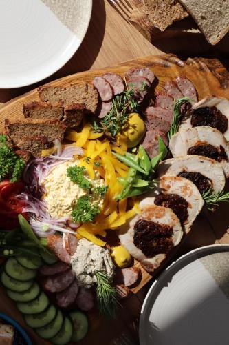 a plate of food with meat and vegetables on a table at Lawendowy Raj in Pilchowice