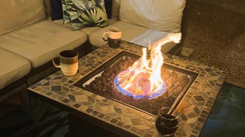 a fire pit on a table in a living room at Tranquil Mesa Retreat in Mesa