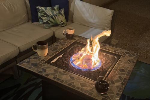 a fire pit on a table in a living room at Tranquil Mesa Retreat in Mesa