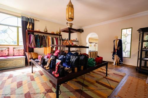 a room with a table filled with lots of bags at Olinto, Atlas Mountain Retreat - adults only in Ouirgane