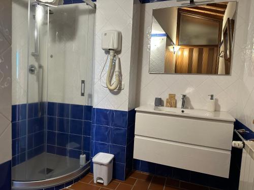 a bathroom with a sink and a shower and a toilet at Bio Agriturismo Il Melograno di Banditella Ristorante in Alberese