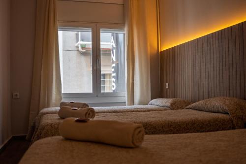 Ein Bett oder Betten in einem Zimmer der Unterkunft Can Setmanes by CozyCatalonia