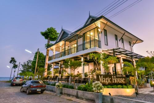 a house with a car parked in front of it at Magic House - No Pets Allowed in Chumphon