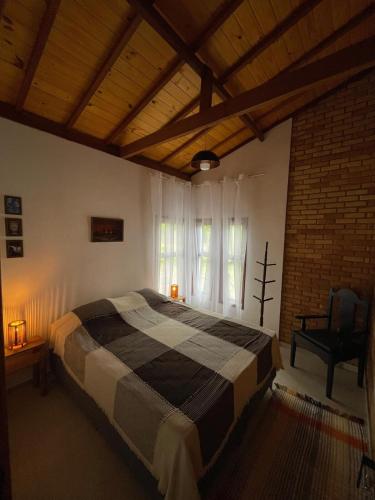 Ένα ή περισσότερα κρεβάτια σε δωμάτιο στο Casa Porta da Vila - Ibitipoca