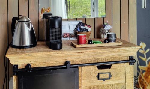 a table with a coffee maker on top of it at L'Oustalou - Suite de 19m² aux portes de l'Aubrac in Aumont-Aubrac