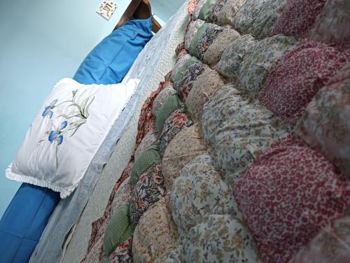 a close up of a quilt on a bed at Il girasole in Sasso di Castalda