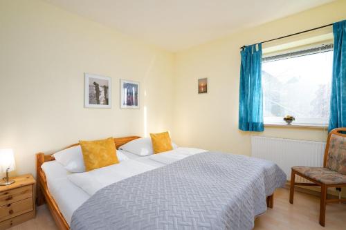 En eller flere senge i et værelse på Haus am Hügel