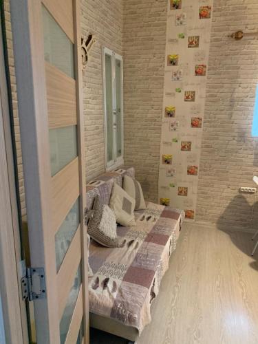 a bedroom with a bed in a room at apartamenti drevni batumi in Batumi
