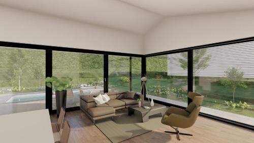 a living room with a couch and a chair at Bungalow KONI in Annaberg im Lammertal