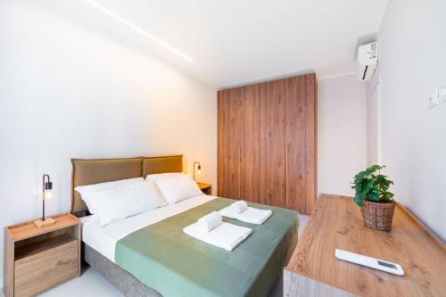 a bedroom with a bed with two towels on it at Borgo Trento Residence in Verona