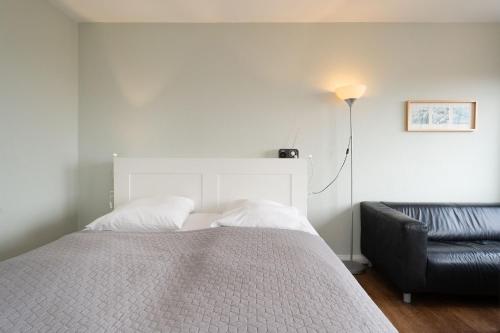 En eller flere senge i et værelse på Stranddistel 4 Bootsblick