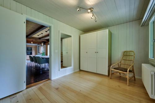 a living room with a chair and a table at Chalet Mountain Love, spectacular views, spacious & luxurious in Lauterbrunnen