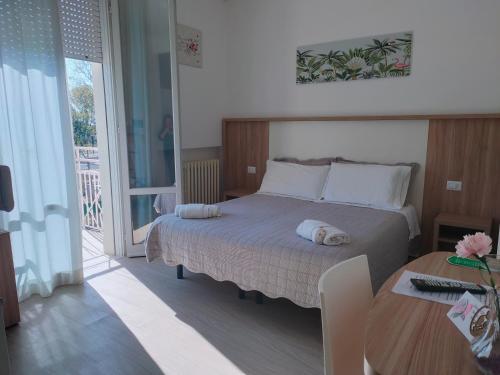 En eller flere senge i et værelse på B&b villa lambusta