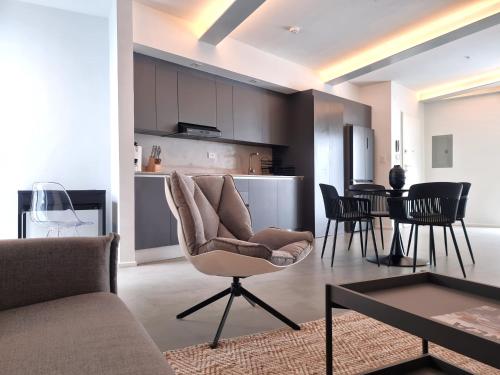 a living room with a couch and a table at Lesplanade By Wynwood House in Panama City