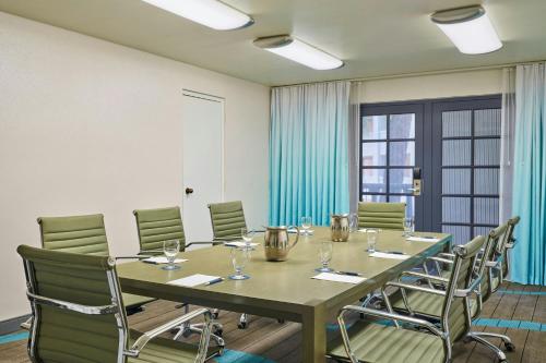 a conference room with a long table and chairs at Sheraton Tucson Hotel & Suites in Tucson