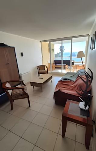 a bedroom with a bed and a view of the ocean at Algarrobo Depto Vista Mar 3D2B, Pinares Canelillo in Algarrobo