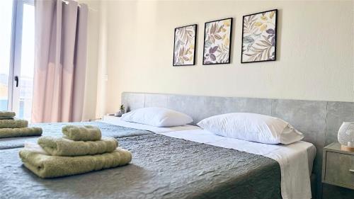 Postel nebo postele na pokoji v ubytování Sea Side Rooms