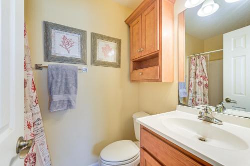 a bathroom with a sink and a toilet at Steps to Beach NMB Condo with Balcony and Pool Access in Myrtle Beach