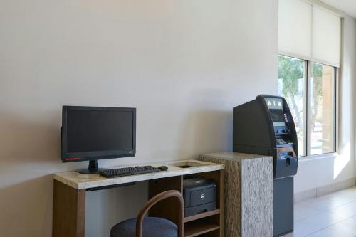 an office with a desk with a computer and a printer at Residence Inn Phoenix Desert View at Mayo Clinic in Phoenix