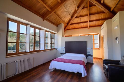 Postel nebo postele na pokoji v ubytování Hostal El Palacio