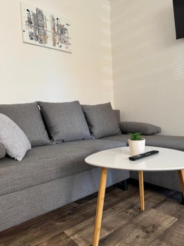 a living room with a couch and a table at Ubytování 121 - Hlohovec in Hlohovec