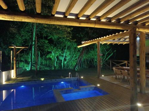 Bazén v ubytování Villa Tropical PdF Completo Cozinheira excelente opcional nebo v jeho okolí