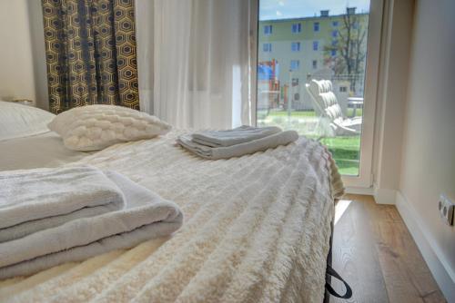 Letto o letti in una camera di HelApart - Casa Baia