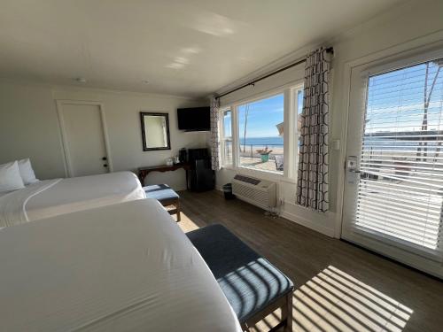 Ένα ή περισσότερα κρεβάτια σε δωμάτιο στο Casablanca Inn on The Beach