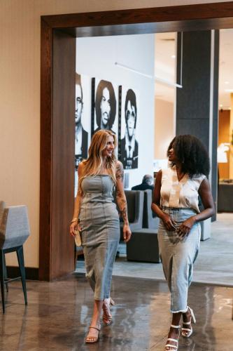 two women walking down a hallway in a store at The Westin Jackson in Jackson
