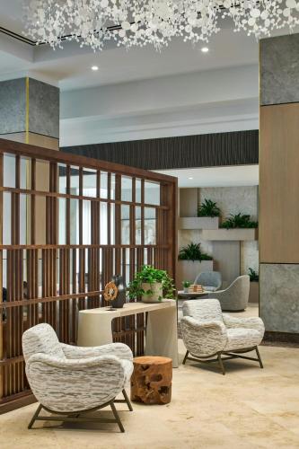 a lobby with two chairs and a table at The Westin Charlotte in Charlotte