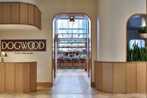 a view of the entrance to a dogwood restaurant with a bar at The Westin Charlotte in Charlotte
