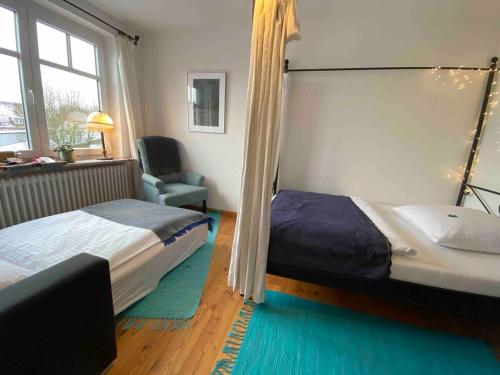 Postel nebo postele na pokoji v ubytování Das Blaue Haus