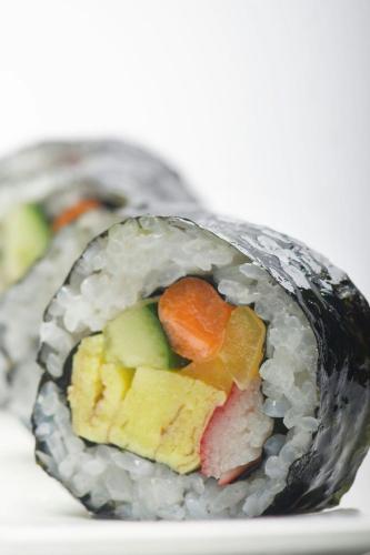 a bowl of sushi with vegetables in it at Le Meridien Al Khobar in Al Khobar
