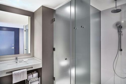 a bathroom with a shower and a sink at AC Hotel by Marriott Lima Miraflores in Lima