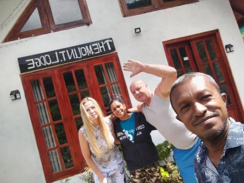 a group of people standing in front of a building at The Mount Lodge in Nuwara Eliya