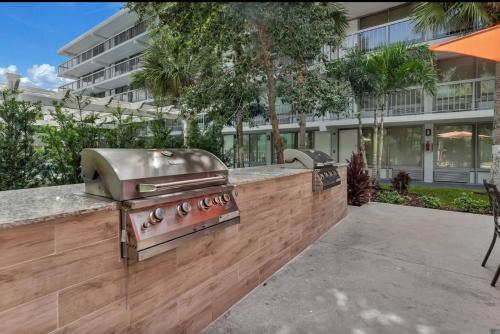 a grill and smoker on a counter in front of a building at The irlo in Kissimmee