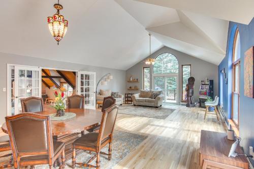 a dining room and living room with a table and chairs at Riverfront Retreat in Nathrop Fire Pits and Hot Tub in Nathrop