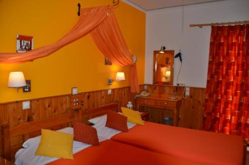 Ein Bett oder Betten in einem Zimmer der Unterkunft Samaina HOTEL
